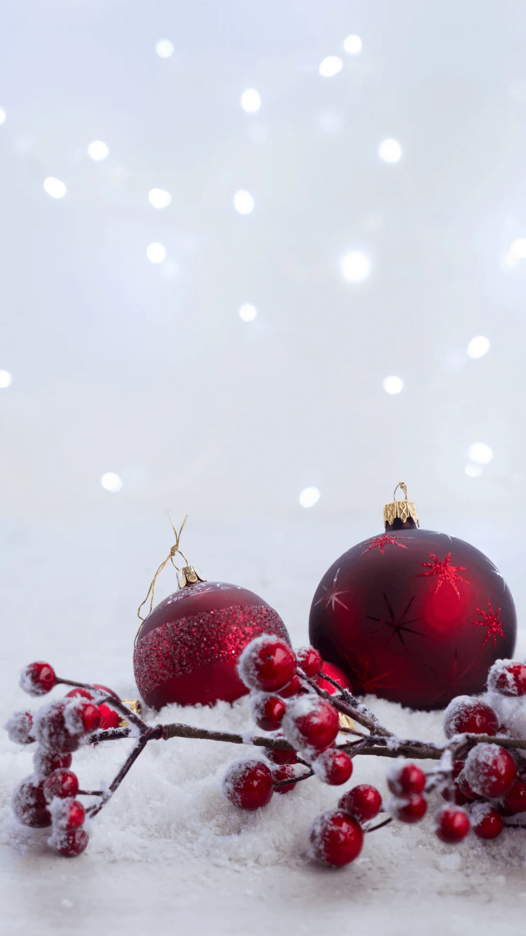 white lights with red baubles and snow - christmas wallpaper iphone