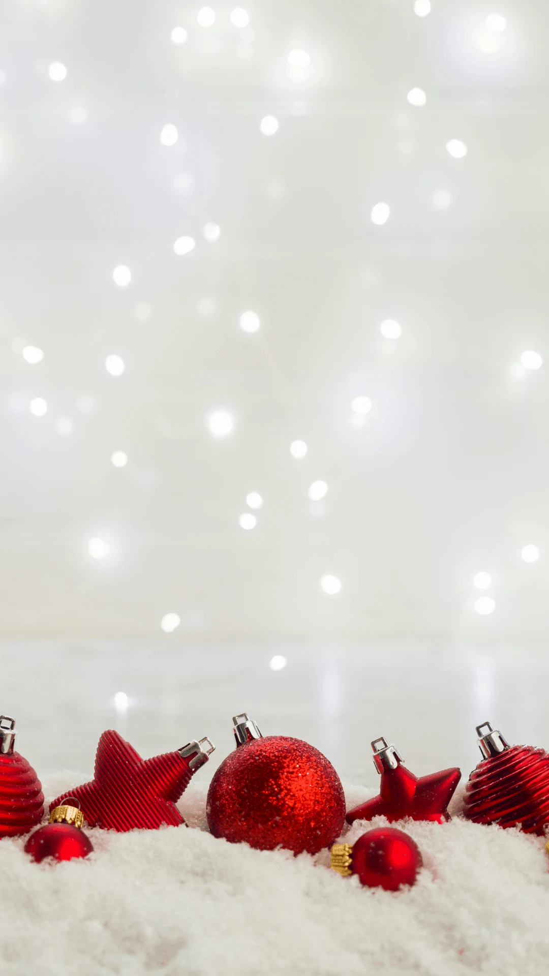 white lights and snow with red baubles - christmas wallpaper iphone