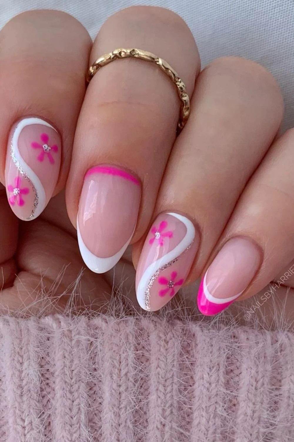 Flower nail designs are trendy, customizable, and easy to create using dotting tools and nail polish. While traditionally associated with spring, floral nail designs can be embraced year-round by adjusting color palettes to suit the summer, fall or winter. They work well on natural nails as well as acryllic, gel, or dip nails. You can also add rhinestones. Simple, short nails, french tips, almond, blue, pink, green, coffin, white, purple, cute, simple.