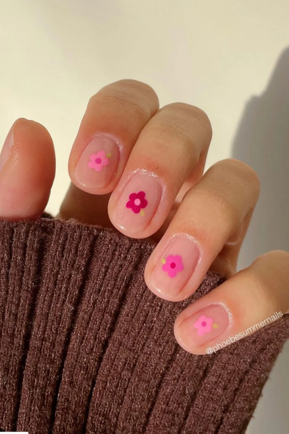 Flower nail designs are trendy, customizable, and easy to create using dotting tools and nail polish. While traditionally associated with spring, floral nail designs can be embraced year-round by adjusting color palettes to suit the summer, fall or winter. They work well on natural nails as well as acryllic, gel, or dip nails. You can also add rhinestones. Simple, short nails, french tips, almond, blue, pink, green, coffin, white, purple, cute, simple.