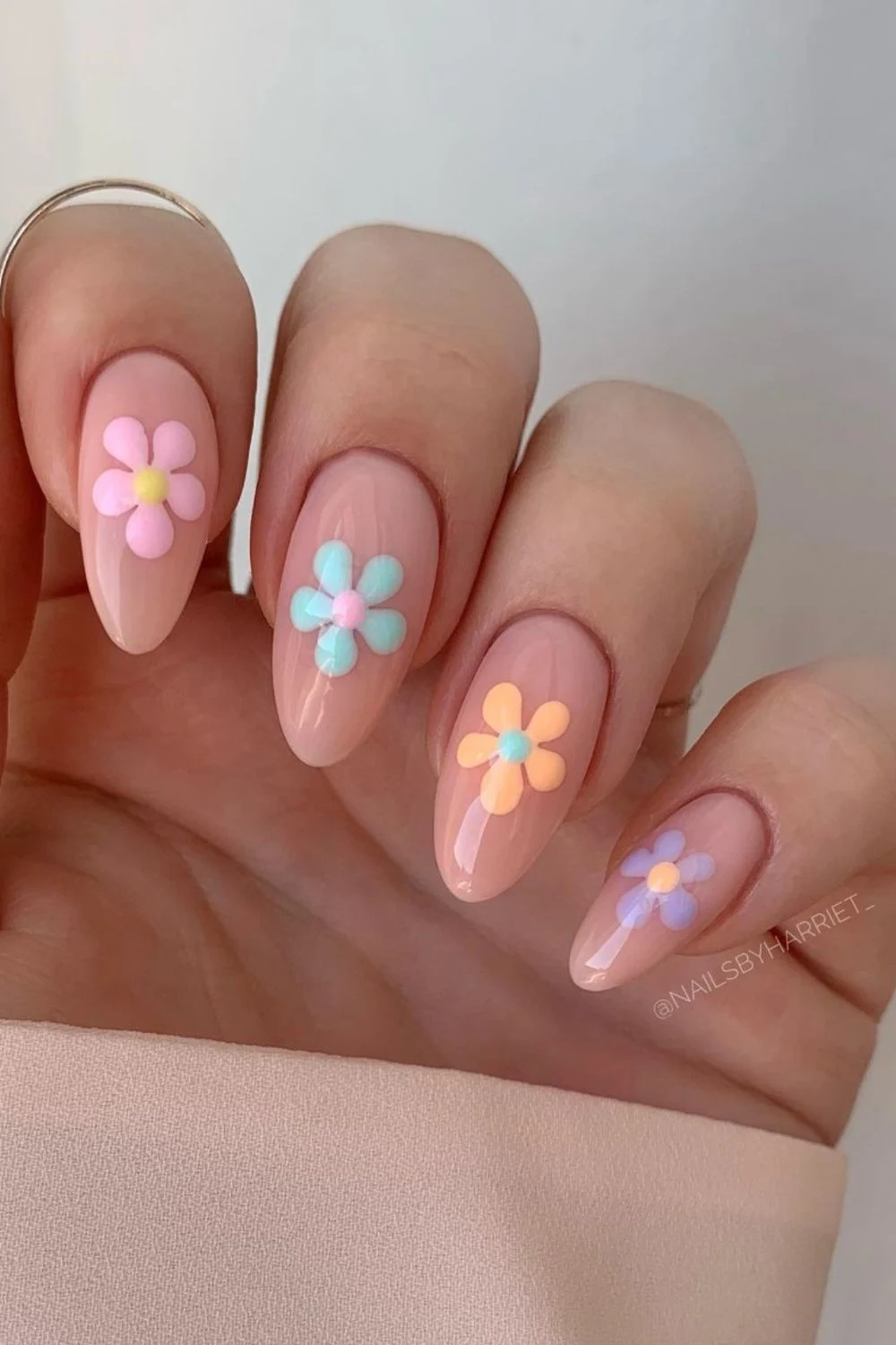 Flower nail designs are trendy, customizable, and easy to create using dotting tools and nail polish. While traditionally associated with spring, floral nail designs can be embraced year-round by adjusting color palettes to suit the summer, fall or winter. They work well on natural nails as well as acryllic, gel, or dip nails. You can also add rhinestones. Simple, short nails, french tips, almond, blue, pink, green, coffin, white, purple, cute, simple.