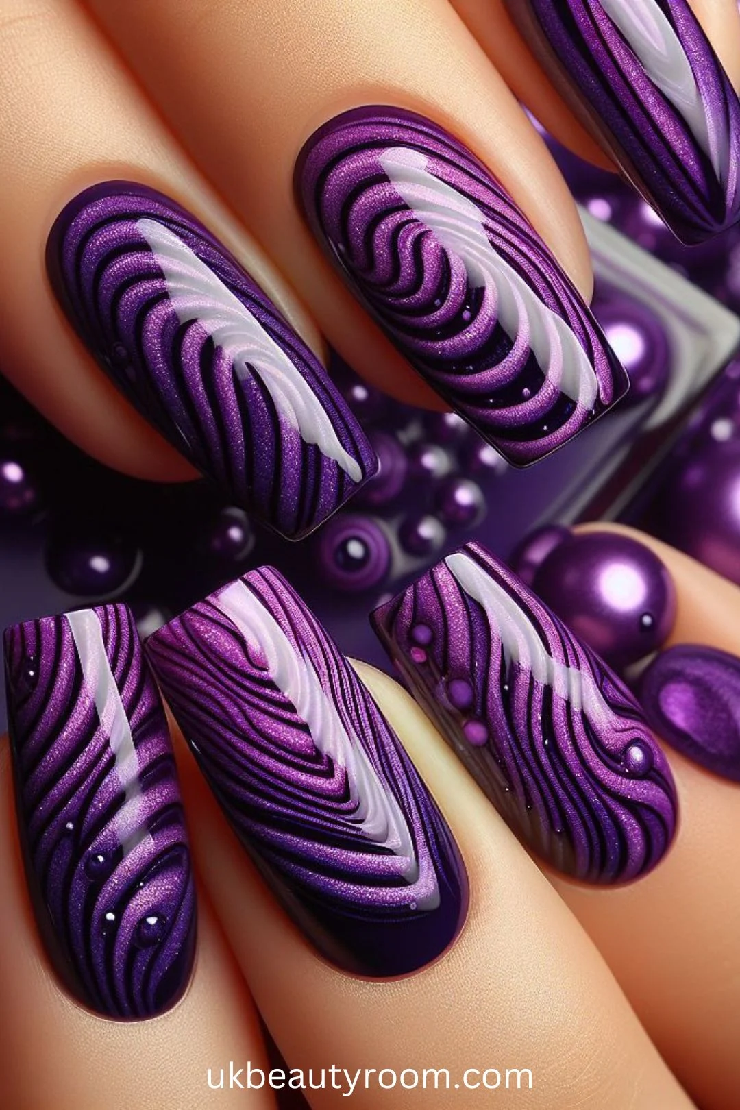 Purple nails are all the rage lately, as they exude elegance and versatility. From soft lavender hues to bold plum tones, purple nail designs offer a chic and stylish touch to any look.  This post lists 43 different purple nail designs to inspire your next manicure including: light, pink and, dark, simple, pastel, bling, short, almond, cute, blue and
