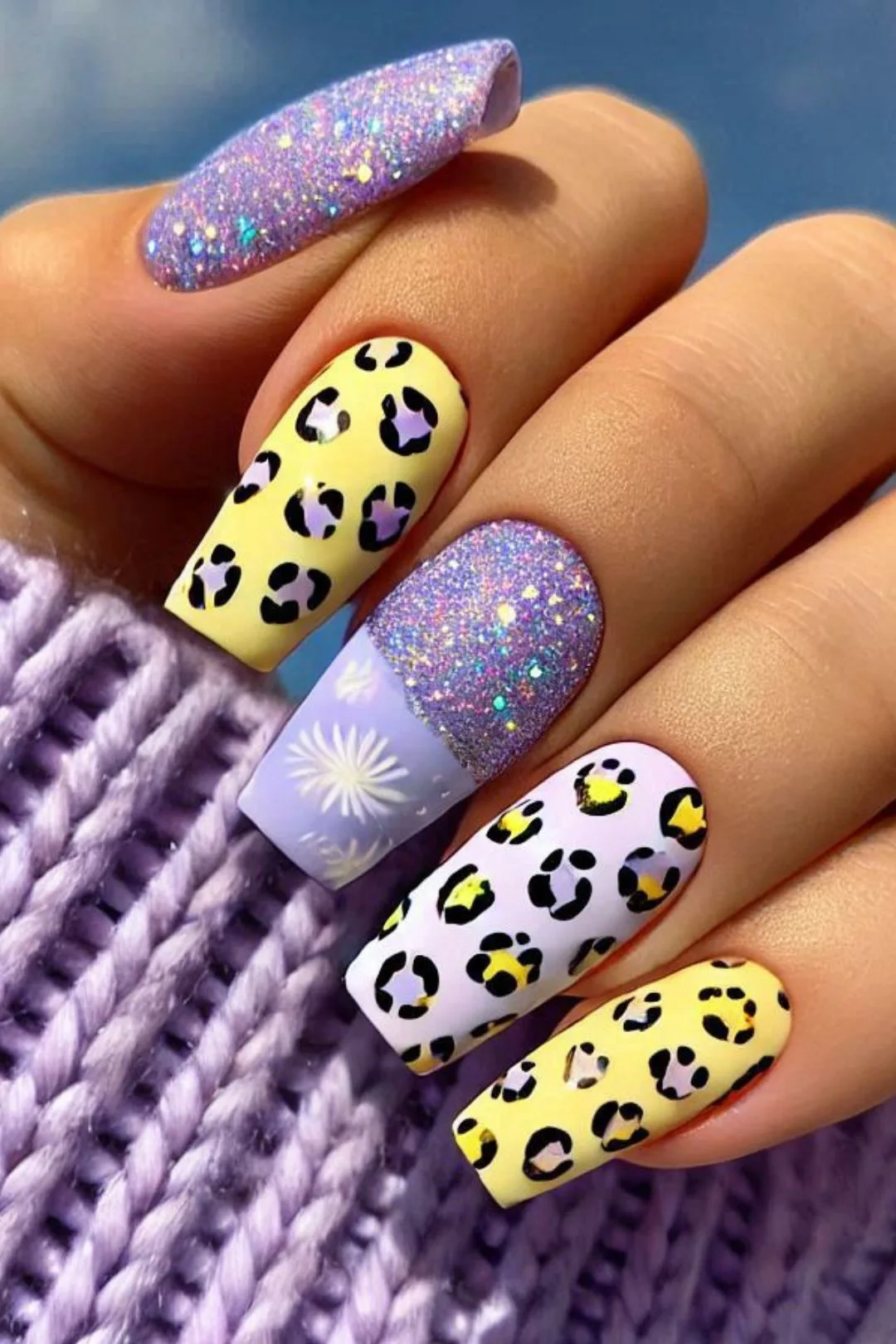 Sparkly Yellow and Lavender leopard print nails.  Explore stunning leopard print nail designs in vibrant colors like red, pink, blue, and cherry red. From short pink nails to bold dark red and wine red shades. Whether you love square or almond shapes, there's something for everyone, including french tip red nails and cute bow accents. Get creative with DIY art and unique cherry designs for a chic, personalized touch.