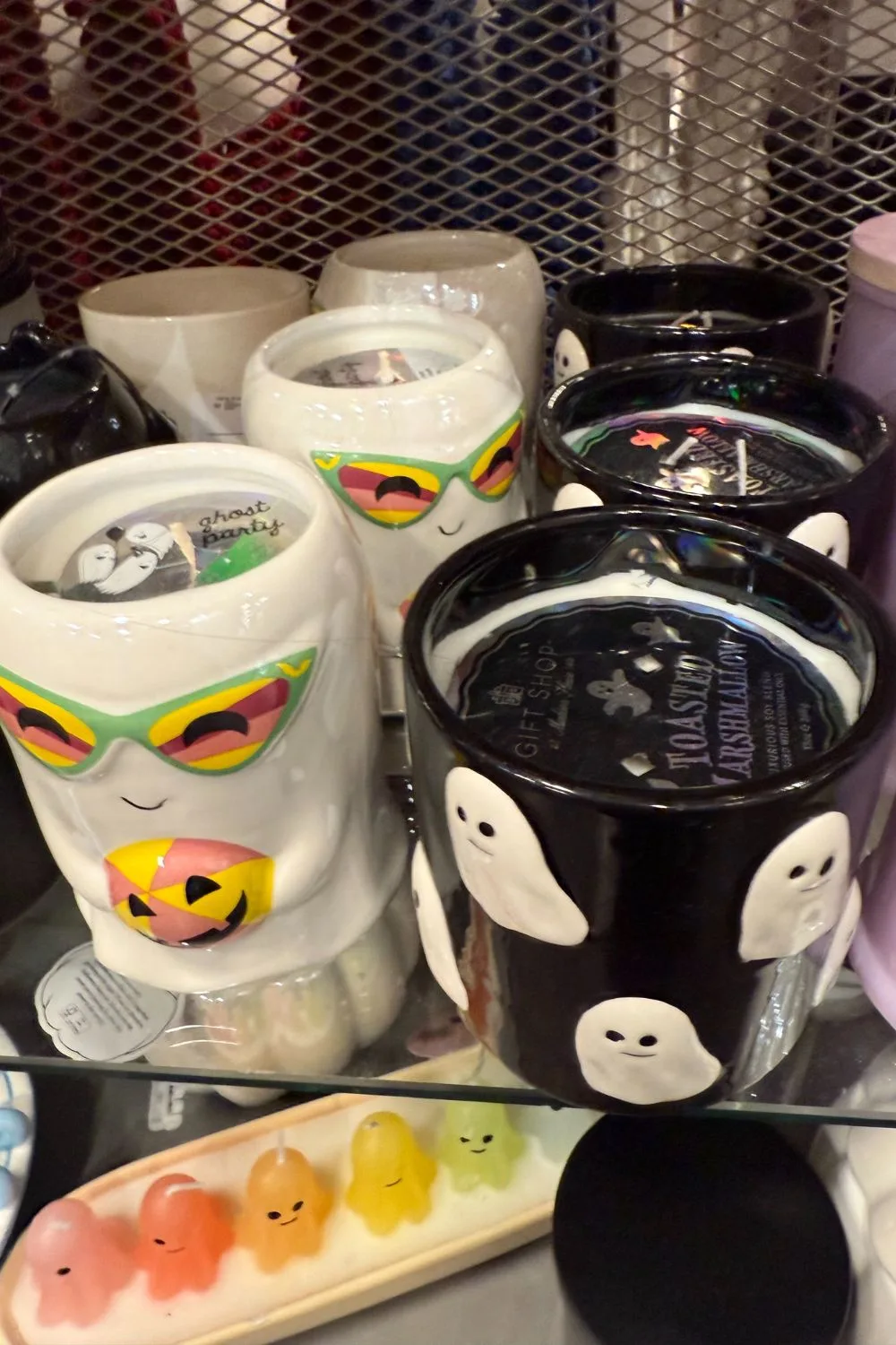 Halloween ghost candles with sunglasses and Black jar Halloween candle with white ghost pattern from TK Maxx.