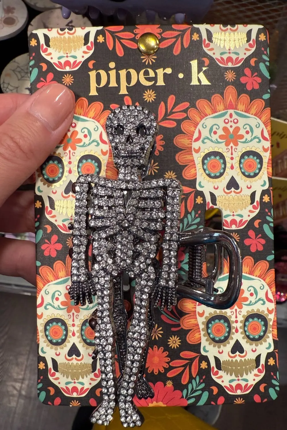 Rhinestone skeleton hair clip with sparkling crystal details.