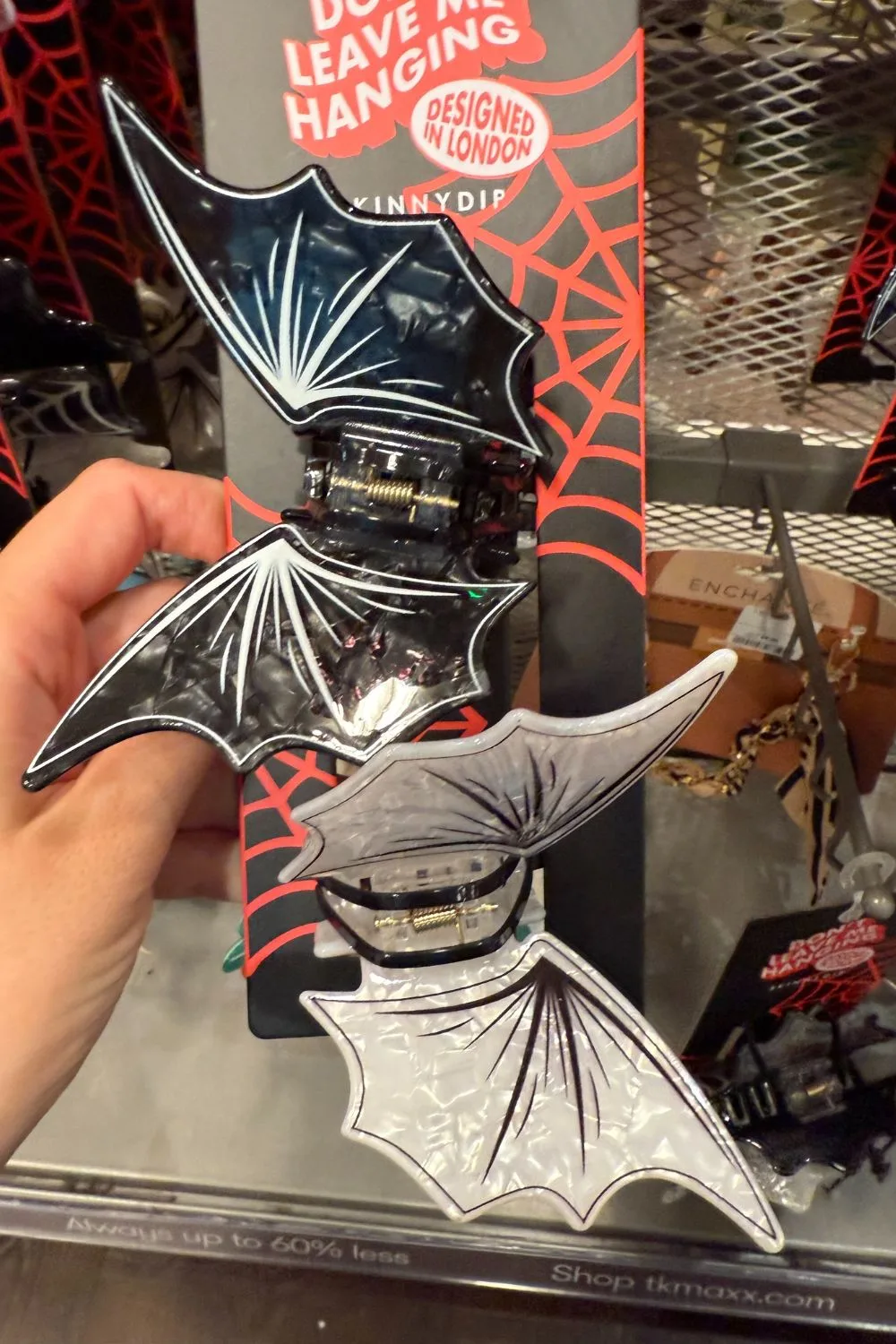 Black and white bat wing-shaped Halloween hair clips.