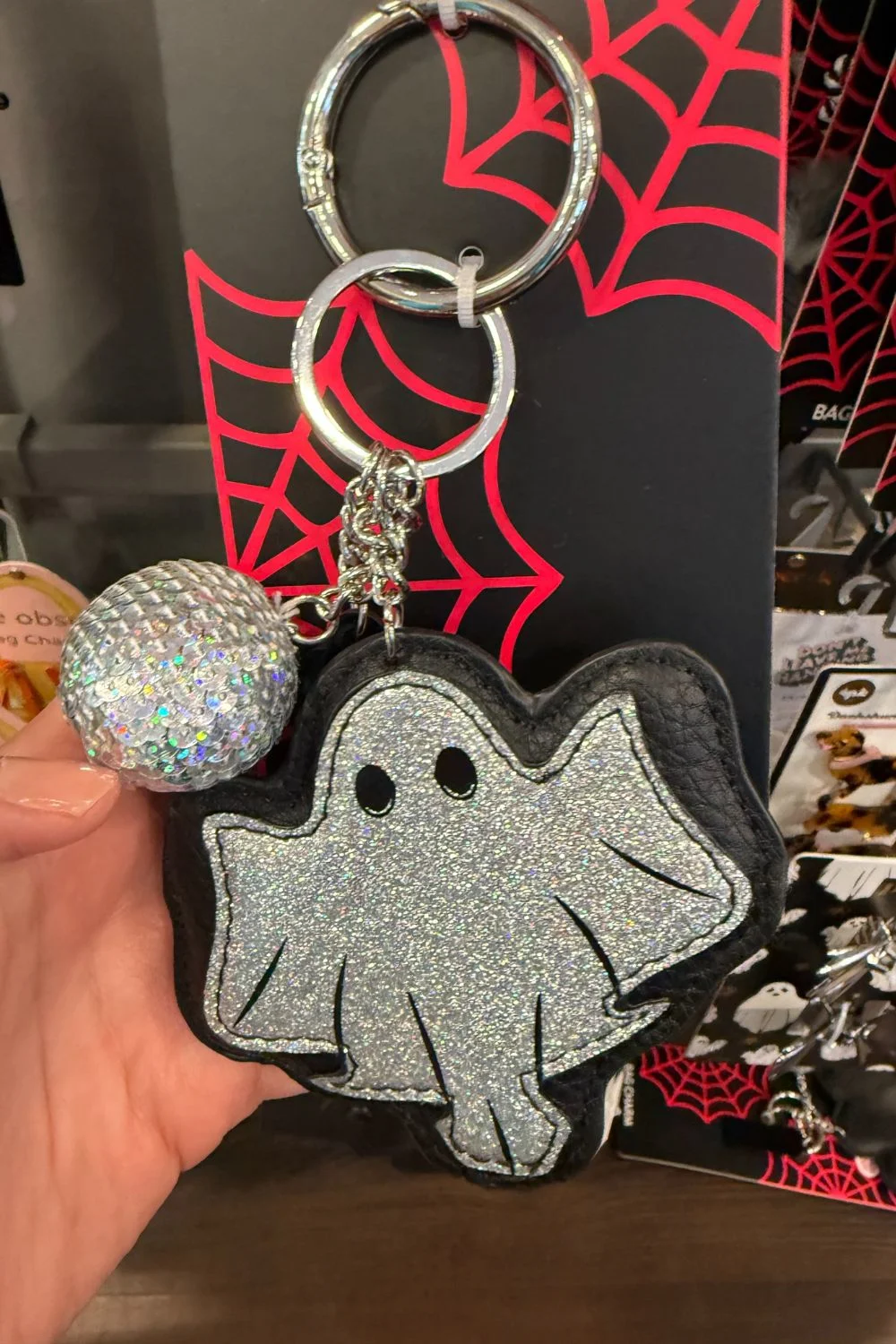 Glittery ghost Halloween bag charm with silver disco ball keyring.
