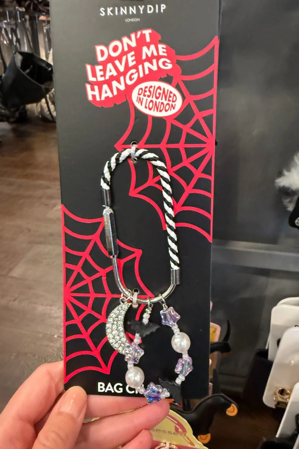 Halloween bag charm with rhinestone moon, bats, and purple beads.